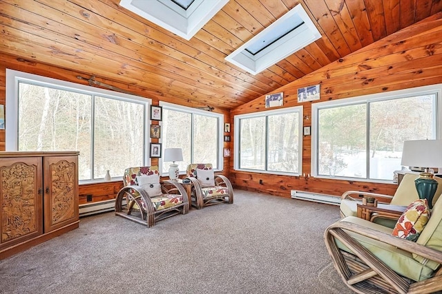 sunroom with vaulted ceiling with skylight, wooden ceiling, and a baseboard radiator