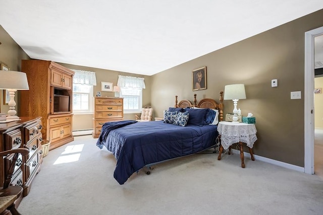 bedroom with light carpet, baseboards, and baseboard heating