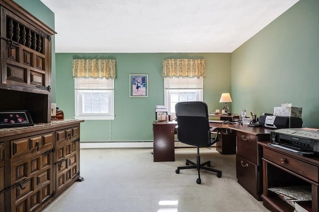 home office with a baseboard heating unit and light colored carpet