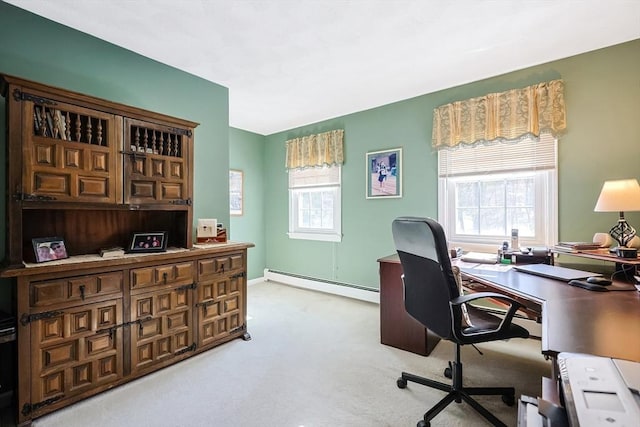 office space featuring light carpet and a baseboard heating unit