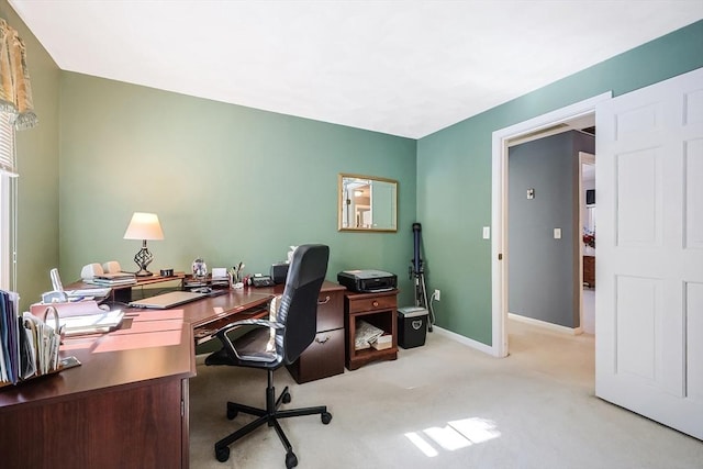 home office with light carpet and baseboards