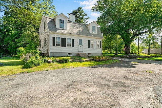 62 County St, Taunton, MA 02780 - view of front of home featuring entry steps and a chimney