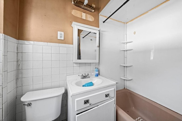 62 County St, Taunton, MA 02780 - bathroom featuring vanity, toilet, tub / shower combination, and tile walls