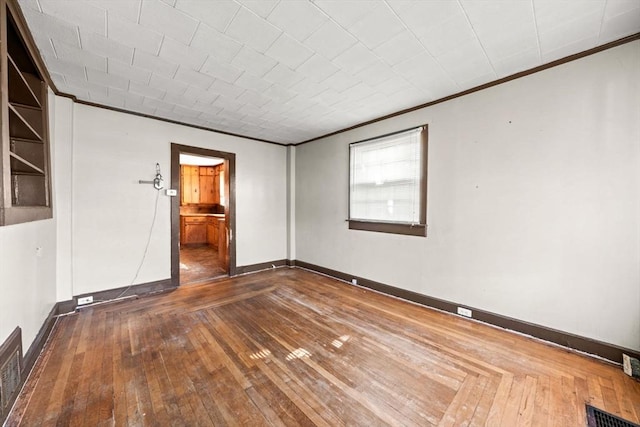 62 County St, Taunton, MA 02780 - unfurnished room featuring crown molding, hardwood / wood-style floors, and baseboards