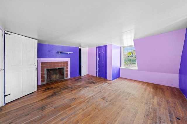 62 County St, Taunton, MA 02780 - unfurnished living room featuring wood-type flooring and a fireplace with flush hearth