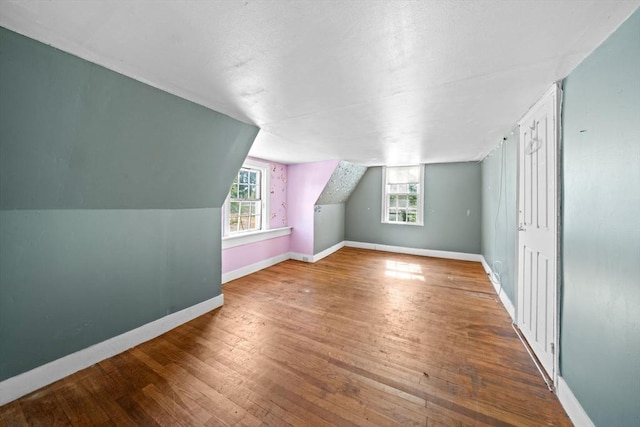 62 County St, Taunton, MA 02780 - additional living space with plenty of natural light, wood-type flooring, baseboards, and lofted ceiling