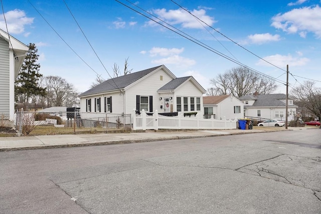 view of front of home featuring a fenced front yard and a residential view