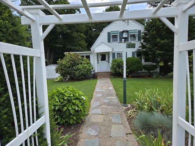 38 N W St, Agawam, MA 01030 - view of front facade featuring a front yard and a pergola