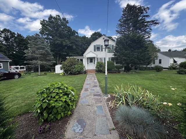 38 N W St, Agawam, MA 01030 - colonial inspired home with a front yard and a gambrel roof