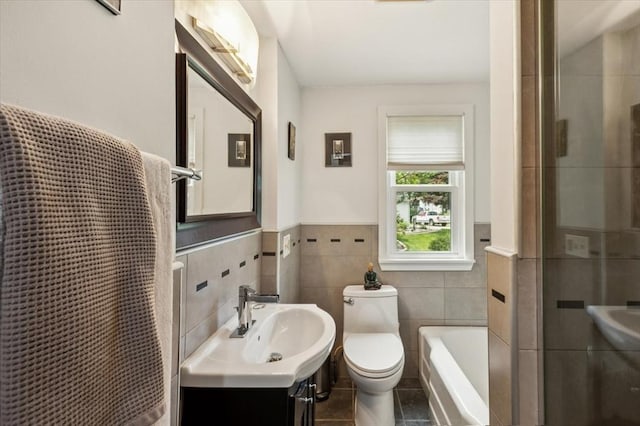 38 N W St, Agawam, MA 01030 - full bathroom featuring tile walls, tile patterned floors, a wainscoted wall, a shower with shower door, and a bathtub