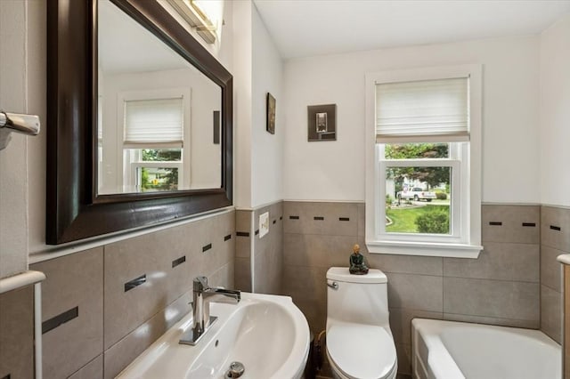 38 N W St, Agawam, MA 01030 - full bath featuring a bath, tile walls, and wainscoting
