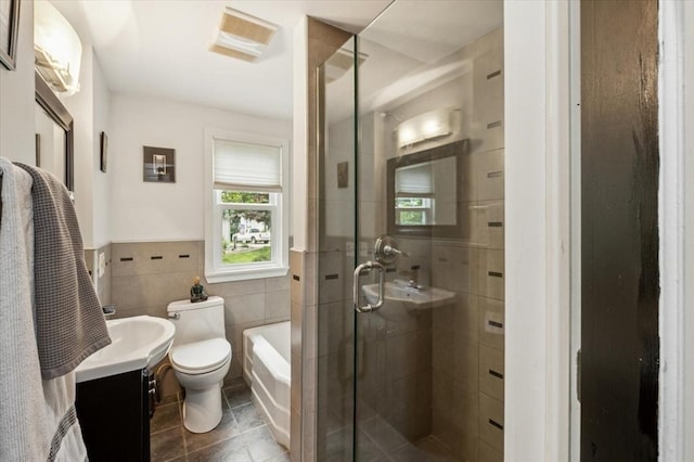38 N W St, Agawam, MA 01030 - bathroom featuring tile walls, vanity, a shower stall, tile patterned flooring, and a bath
