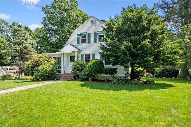 38 N W St, Agawam, MA 01030 - colonial inspired home featuring a front lawn and a gambrel roof