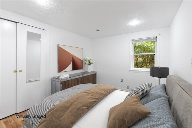 bedroom featuring wood finished floors