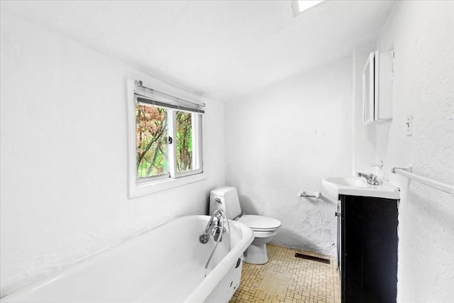 full bath featuring a bath, toilet, and vanity