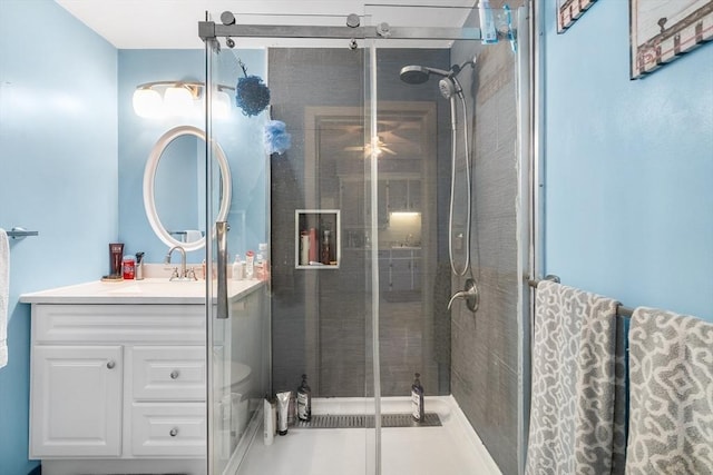 full bathroom with a stall shower and vanity