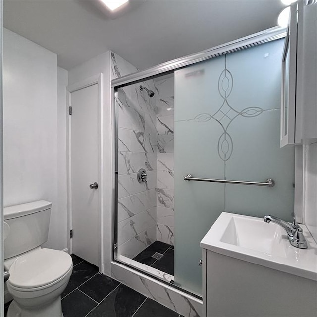 full bath featuring vanity, a shower stall, and toilet