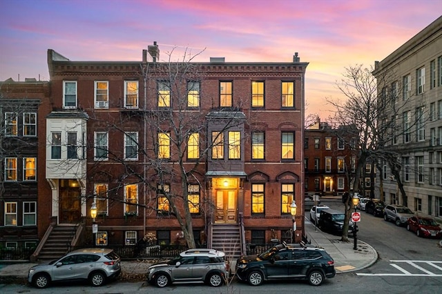 view of property featuring brick siding