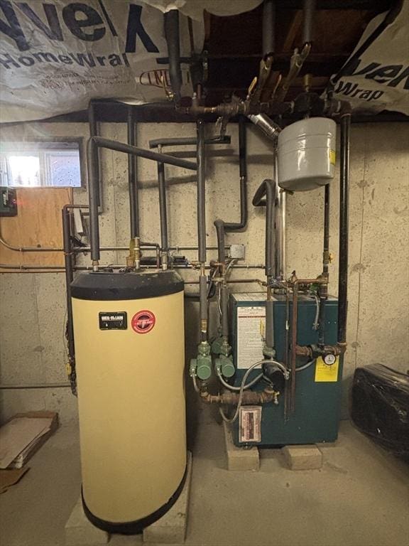 utility room featuring gas water heater