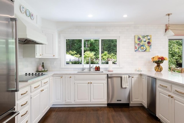 130 Hickory Rd, Weston, MA 02493 - kitchen with appliances with stainless steel finishes, light countertops, decorative backsplash, white cabinets, and dark wood-type flooring