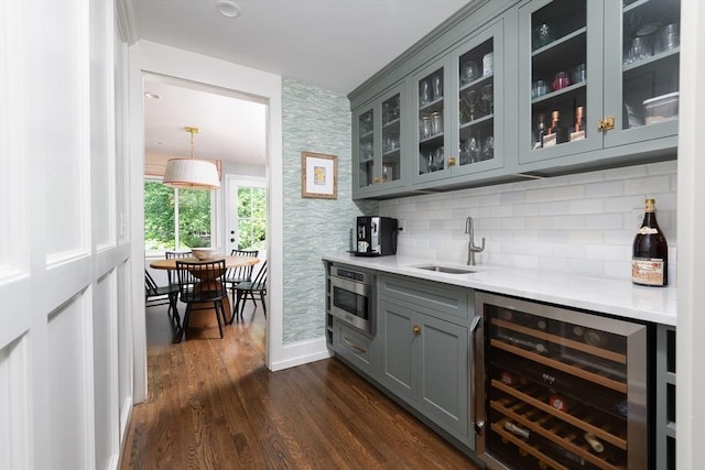 130 Hickory Rd, Weston, MA 02493 - indoor wet bar with beverage cooler, wallpapered walls, dark wood-style flooring, and tasteful backsplash