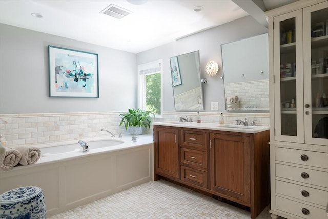 130 Hickory Rd, Weston, MA 02493 - full bath featuring a bath, double vanity, and decorative backsplash