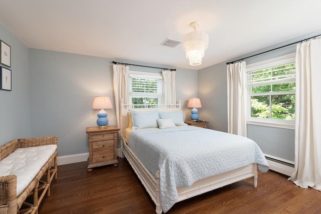 130 Hickory Rd, Weston, MA 02493 - bedroom with a baseboard radiator, dark wood-type flooring, and a chandelier