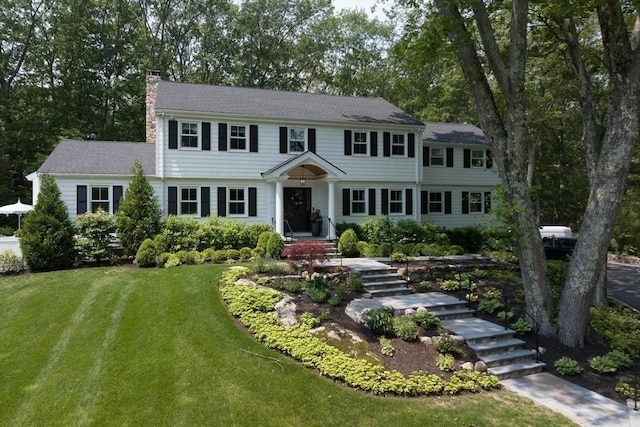 130 Hickory Rd, Weston, MA 02493 - colonial inspired home with a chimney and a front yard