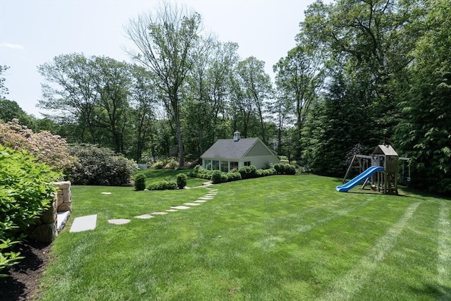 130 Hickory Rd, Weston, MA 02493 - view of green lawn featuring a playground