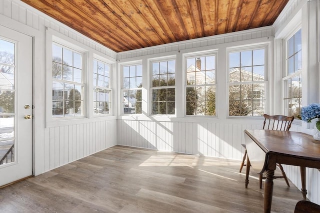 sunroom featuring a wealth of natural light and wood ceiling