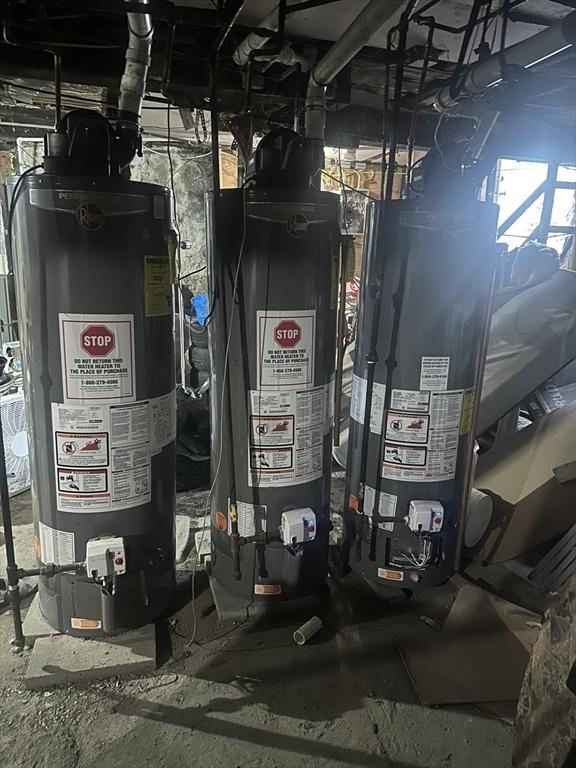 utility room featuring water heater