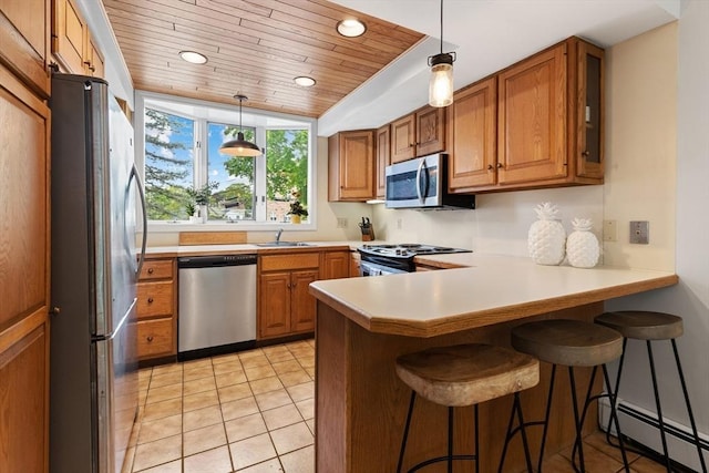 64 Prospect St Unit B, Marblehead, MA 01945 - kitchen featuring appliances with stainless steel finishes, baseboard heating, wood ceiling, a peninsula, and brown cabinetry