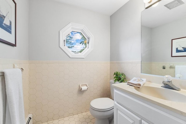 64 Prospect St Unit B, Marblehead, MA 01945 - bathroom with toilet, vanity, a baseboard radiator, and tile patterned floors