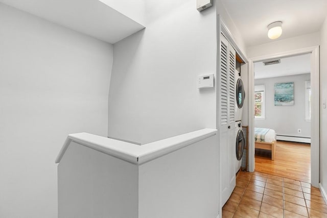 64 Prospect St Unit B, Marblehead, MA 01945 - corridor with baseboard heating and light tile patterned floors