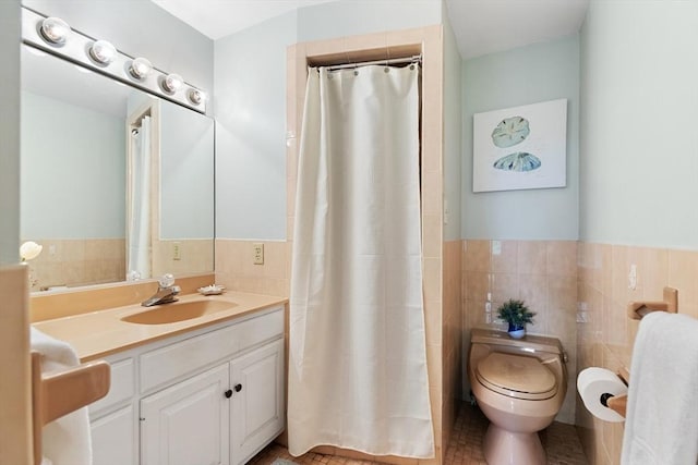 64 Prospect St Unit B, Marblehead, MA 01945 - full bathroom with toilet, vanity, tile walls, a shower with curtain, and a wainscoted wall