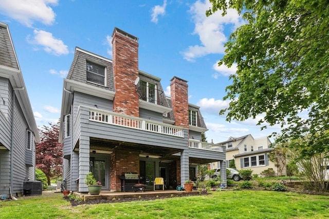 64 Prospect St Unit B, Marblehead, MA 01945 - back of house with a chimney, a yard, central AC unit, a patio area, and a deck