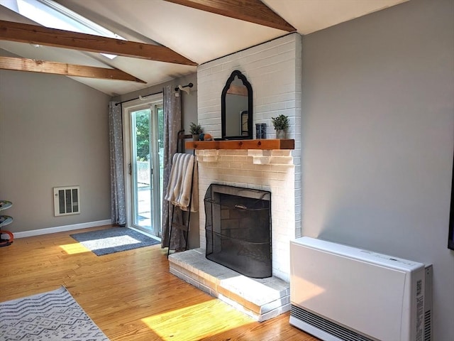 38 Pearson Dr, Newbury, MA 01922 - unfurnished living room with wood finished floors and a brick fireplace
