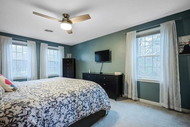 bedroom with light carpet and ceiling fan