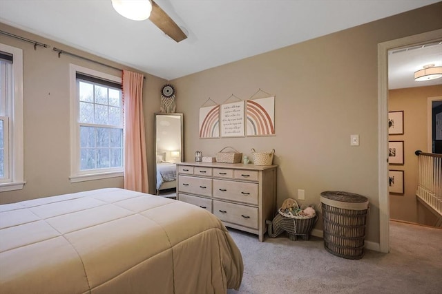 carpeted bedroom with ceiling fan