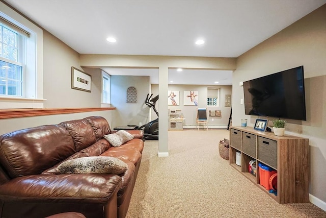 carpeted living room with a baseboard radiator