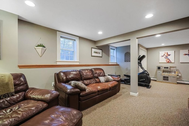 carpeted living room with a baseboard radiator