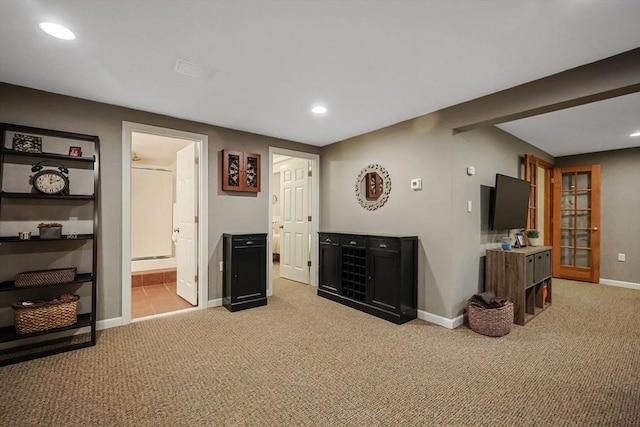 interior space featuring light colored carpet