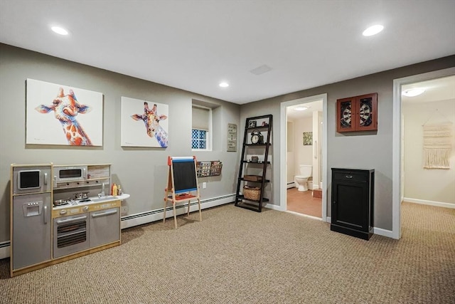 playroom featuring carpet floors and baseboard heating