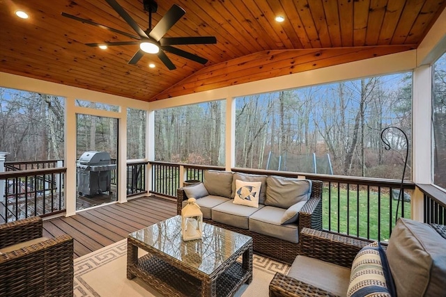 sunroom featuring vaulted ceiling, plenty of natural light, and wood ceiling