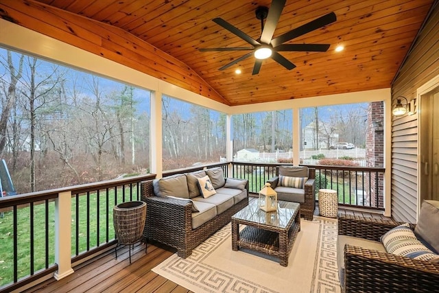 sunroom / solarium with wood ceiling, vaulted ceiling, and ceiling fan