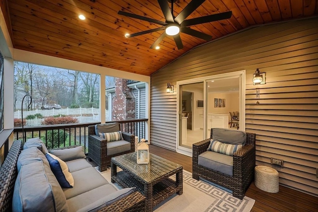 sunroom / solarium with vaulted ceiling, ceiling fan, and wood ceiling