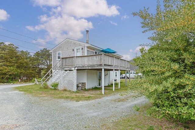 357 Phillips Rd, Sandwich, MA 02563 - view of side of home with driveway and a wooden deck