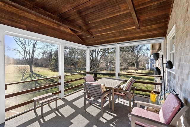 sunroom / solarium with vaulted ceiling with beams and wood ceiling