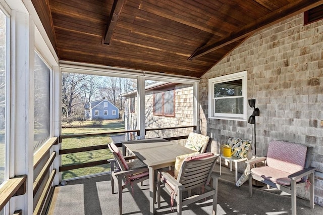 sunroom / solarium with vaulted ceiling with beams and wooden ceiling