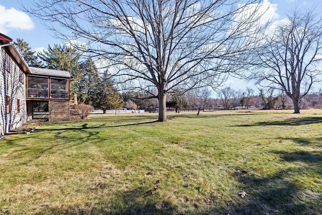 view of yard with a sunroom